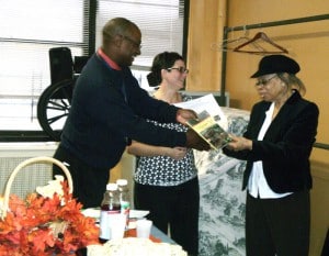 Ms. Earl Receiving Award and Book